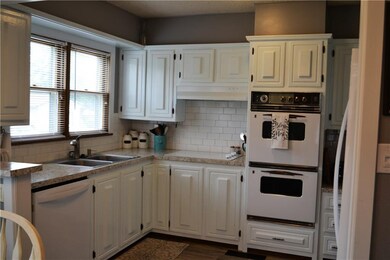 Adorable kitchen with double ovens and fresh updates