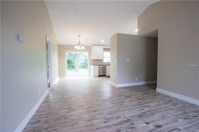 Living room dining room combo.  New 6 foot sliders to backyard patio