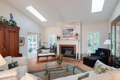 The gas fireplace has two large windows that overl