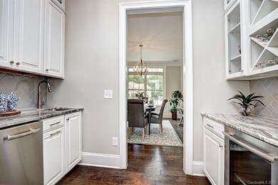 The wet bar between the Dining Room and Kitchen ha