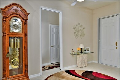Front entry to the right and the pocket door to 2 guest bedrooms and guest bath in center