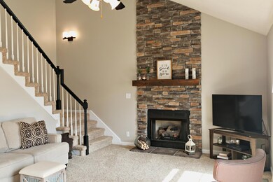 Stacked stone fireplace with gas logs.