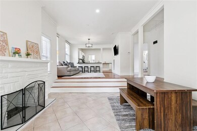 DINING LEADS UP THE STEPS TO LIVING ROOM.
