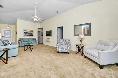 Spacious living room area overlooking the pool and