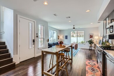 Kitchen with stainless steel appliances, dark woo