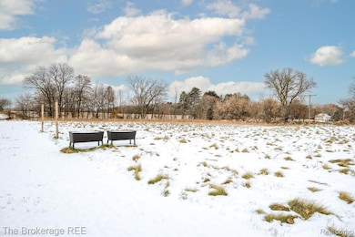 View of yard covered in snow