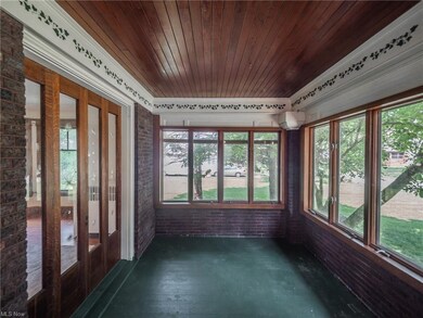 Front porch looking west with dinning room doors