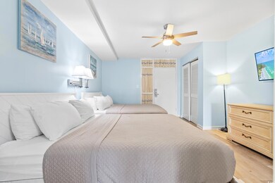 Bedroom featuring ceiling fan and light hardwood /