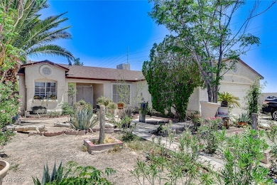 View of front of house featuring stucco siding and