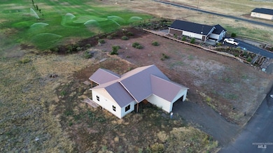 Aerial view of property and surrounding area with a local golf course