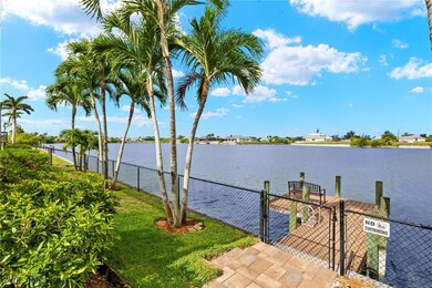 Dock area with a gate and a water view