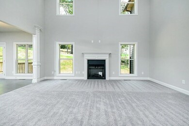Unfurnished living room with plenty of natural lig