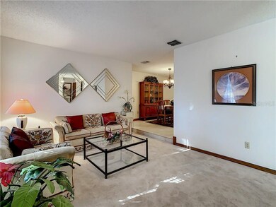 Separate front living room with extra plush carpeting