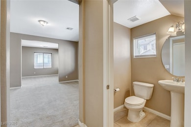 Bathroom with toilet and baseboards