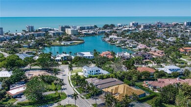 Drone / aerial view with a view of city and a water view