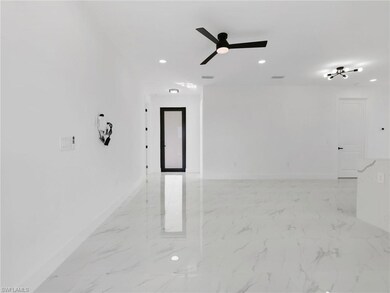 Unfurnished room with light marble finish floors, recessed lighting, and a ceiling fan