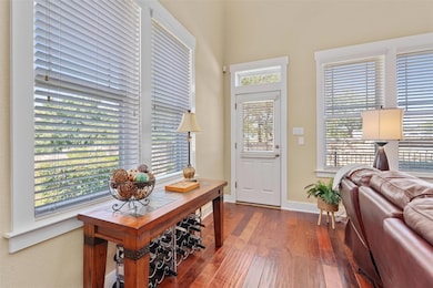 Entryway with hardwood / wood-style floors and ba