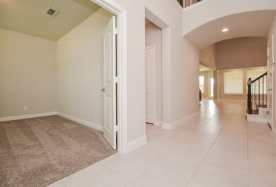 Home has an open two story foyer and tile throughout main traffic areas