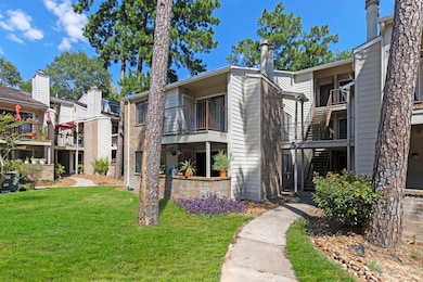 Second-story unit. Trees around the apartment comp