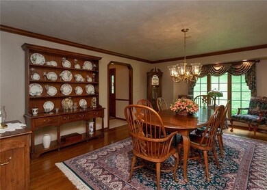 Formal Dining room with crownmold and  Hardwood Fl