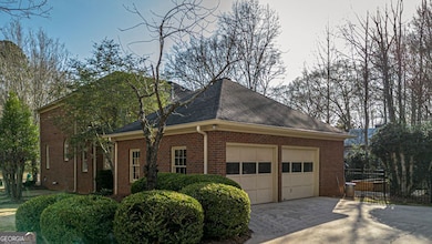 Garage Entrance at back with Workshop .