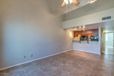 Opens to Kitchen w/ Breakfast Bar