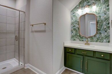 This second bathroom on the first floor is spacious with a standup shower.
