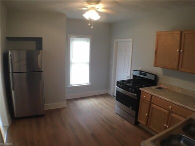Kitchen with hardwood floors and stainless steel a