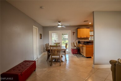 Dining area featuring french doors, light tile pat