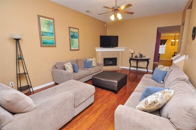 A cozy gas log fireplace highlights the family-siz