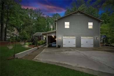 View of property exterior featuring driveway, a la