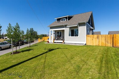 Landscaped front yard with an east-facing covered