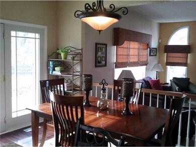 Eat in area of the kitchen with patio doors leadin
