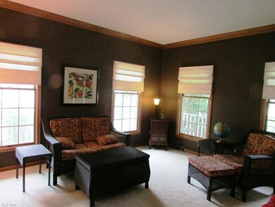 The formal living room w/crown molding is off of the dining room & foyer.