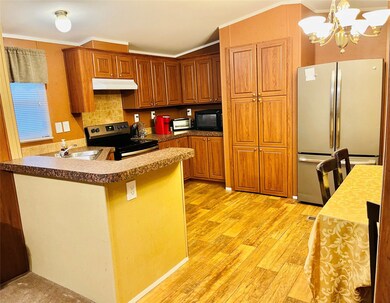 Ample kitchen with walk-in laundry and pantry.