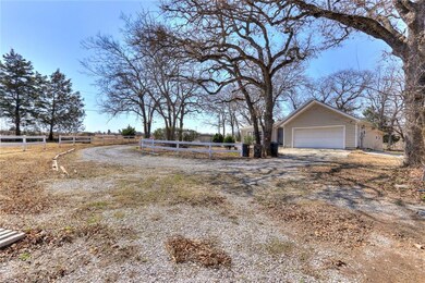 View of the driveway, garage from the red barn on 