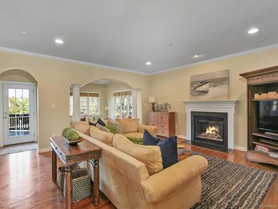 Family Room with gas fireplace and hardwood floors