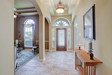 Light and bright Entry: Mahogany front door with 3