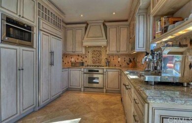 This chef's dream kitchen features gorgeous granit