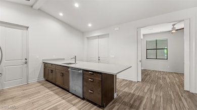 Kitchen with ceiling fan, light hardwood / wood-st