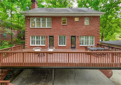 This stately four-sided brick residence offers an extraordinary lifestyle opportunity, positioned equidistant from downtown Decatur and the heart of Oakhurst and within the sought-after City of Decatur school district.