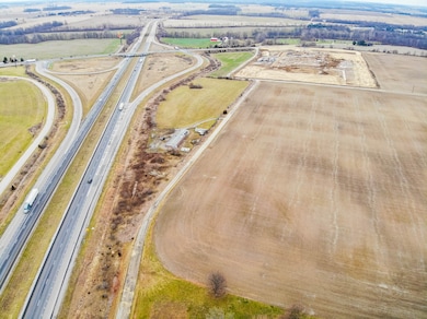 Looking east, showing property adjacent to interstate and ramp, in center of picture.