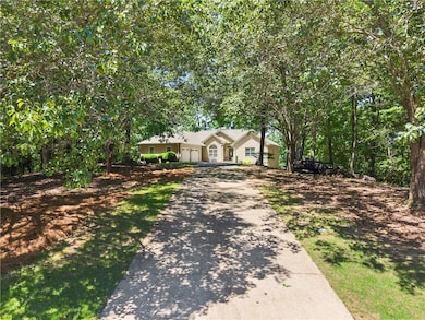 Single story home featuring driveway and a garage