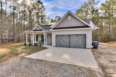 View of front of home featuring covered porch, sol