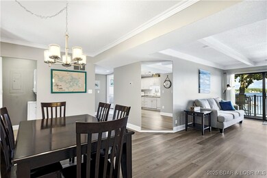 The kitchen opens up to the dining area and the li