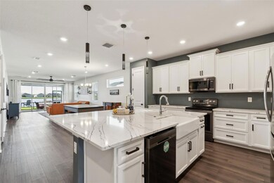 Kitchen overlooking dining room and living room