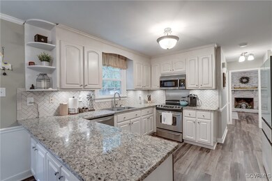 Kitchen with granite countertops and ceramic backsplash