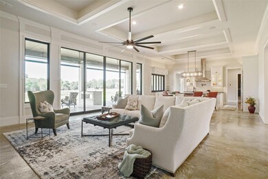 Living room with ornamental molding, ceiling fan w