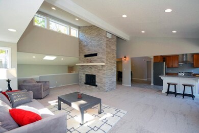 Note the high ceilings, recessed lights, open layo