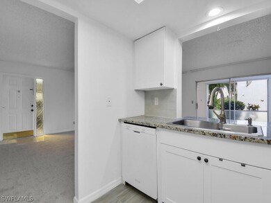 Kitchen w/ Pass-Thru To Dining Area
